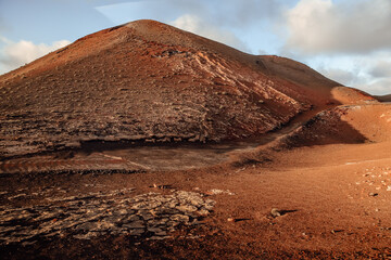 Scenic volcanic landscape with the road at Timanfaya National Park, Lanzarote island