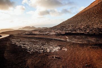 Scenic volcanic landscape with the road at Timanfaya National Park, Lanzarote island