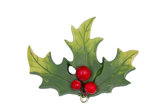 Red holly berry with green leaves isolated on white