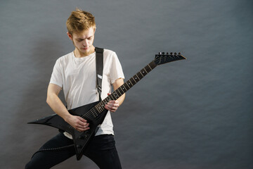 Man playing on electric guitar