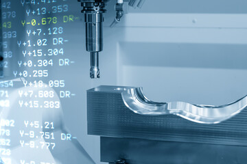 The abstract scene of 5 axis CNC machining center cutting the mold parts with solid ball end-mill tools. The hi-technology mechanical part manufacturing process by 5 axis CNC milling machine.