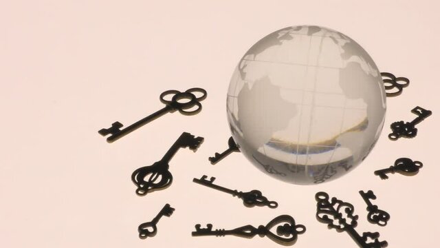 Glass globe and several types of antique keys.