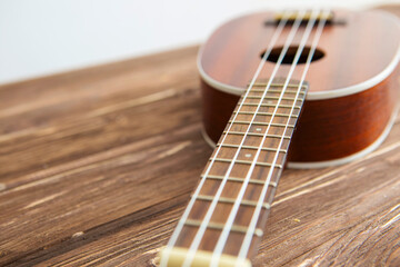Fototapeta premium Photo depicts musical instrument ukulele guitar on a wooden