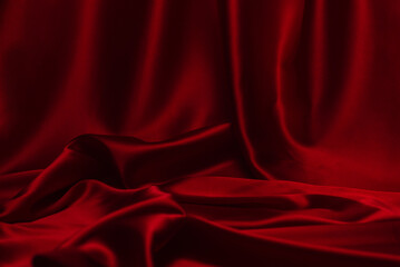 Red silk or satin luxury fabric texture can use as abstract background.