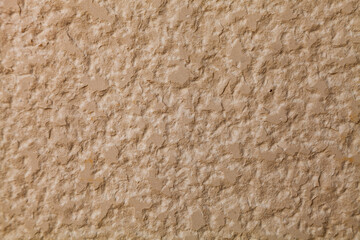 Brown stone wall, close-up background.