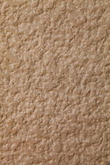 Brown stone wall, close-up background.