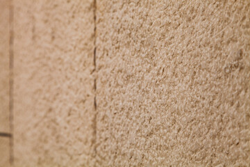 Brown stone wall, close-up background.