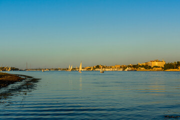 Different vessels on the Nile river in Luxor, Egypt.