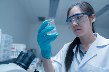 Asian scientist working in the lab,Researchers are research to find the results of the...