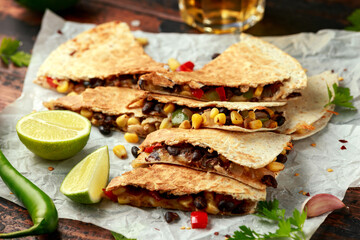 vegetarian black beans tomato corn quesadilla served with cold beer salsa and yogurt dip sause on dark wooden background