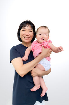 Portrait of Asian Mother Carrying Her Happy Bbaby with Love