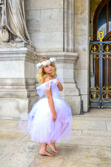 Girl ballerina Paris dance on the old stone background. Old stone background. Beautiful model. Happy dancing people. Love fashion. © Elena