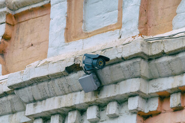 CCTV camera installed on the wall of an old building