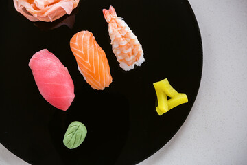 Sushi on black plate