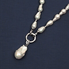 Fototapeta na wymiar Baroque pearl necklace with pendant