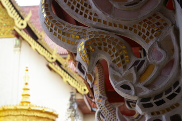close up corbel decorated  with  golden glasses in thailand temple
