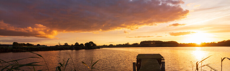 golden sunset at the lake, panorama