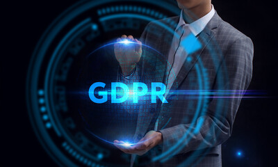 Business, Technology, Internet and network concept. Young businessman working on a virtual screen of the future and sees the inscription: GDPR