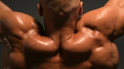 Fitness man pumping up muscle doing pull-ups exercises in gym naked torso. Handsome strong athletic men pumping up back muscles workout fitness and bodybuilding concept background