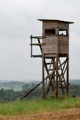 Lonley deerstand for hunters and Hunting on beautyful orange field. This capture was taken 16th of July in Harburg (Schwaben), Bavaria, Germany