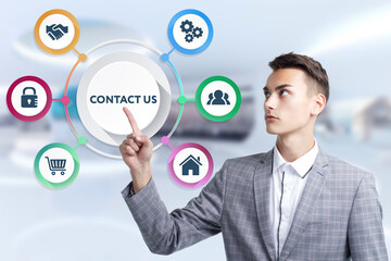 Business, Technology, Internet and network concept. Young businessman working on a virtual screen of the future and sees the inscription: Contact us