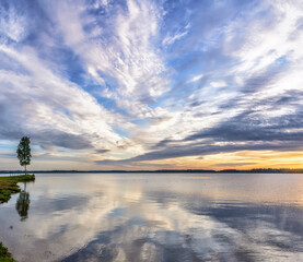 Beautiful summer sunrise on Valdai Lake in July.