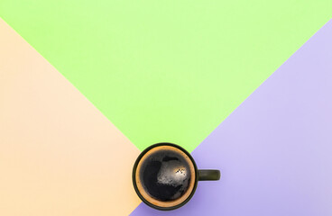 Strong espresso coffee on a pastel colored background