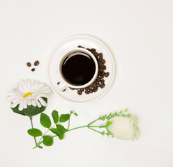 coffee cup with green leaves and flower on white background