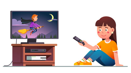 Kid watching tv with remote control in hand