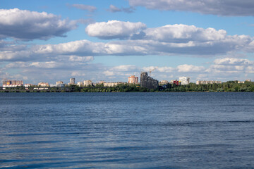 Fototapeta na wymiar Russia, Voronezh. Residential area on the left bank, view from the right bank of the embankment to the left bank.