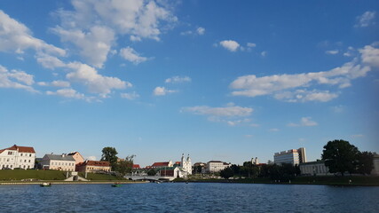 Fototapeta na wymiar Blue sky with clouds over the river