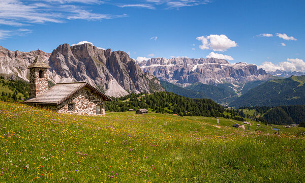 View of mountain chapel infront of Sella group (Sellagruppe, gruppo del sella) from Alp Seceda in Dolomites UNESCO World Heritage in Val Gardena (Gr&ouml;den), South Tyrol (S&uuml;dtirol, Alto Adige), Italy