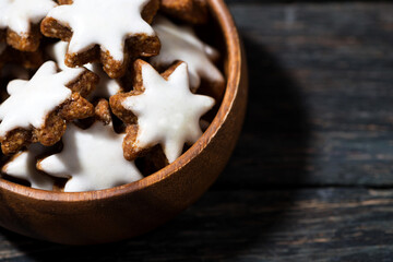 christmas gingerbread cookie in a wooden bowl, closeup