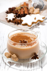 cup of masala tea and Christmas cookies on white background, closeup