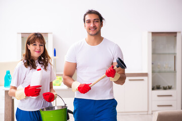 Young pair doing housework at home