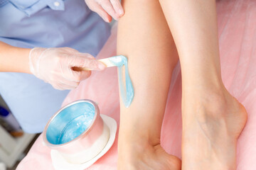 Sugar and waxing depilation of the feet in the beauty salon. Rid of hair on the legs. Sugaring....