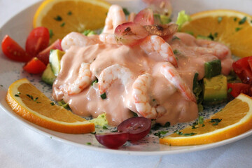 Prawn cocktail with fruits and cocktail sauce