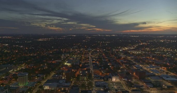 Mobile Alabama Aerial v23 pull out shot of downtown at sunset as the city lights come to life - DJI Inspire 2, X7, 6k - March 2020