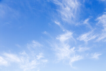 Blue sky background with a white clouds.