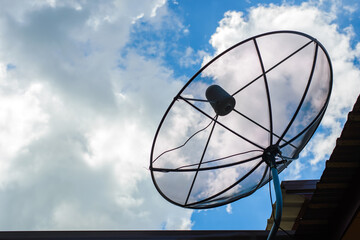 A satellite dish for TV and blue sky background