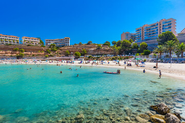 PORT ADRIANO, MALLORCA, SPAIN - 23 July 2020 - Tourists enjoying summer day on the city beach.