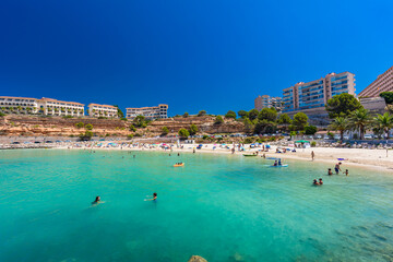 PORT ADRIANO, MALLORCA, SPAIN - 23 July 2020 - Tourists enjoying summer day on the city beach.