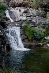 A waterfall in the Arbillas river. Sierra de Gredos. Ávila. Castilla y León. Spain   - obrazy, fototapety, plakaty