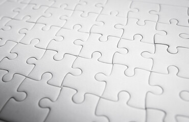 White jigsaw puzzle pattern background.