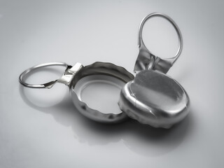 Bottle ring pull cap on gray background