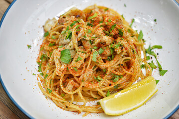 Spicy crab pasta, Seafood spaghetti with chilli pepper, Favorite fusion italian dish in restaurant.