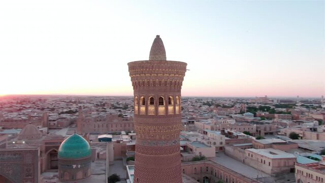 Po-i-Kalyan mosque complex in Bukhara and Kalyan Minaret at sunset, shot by a drone