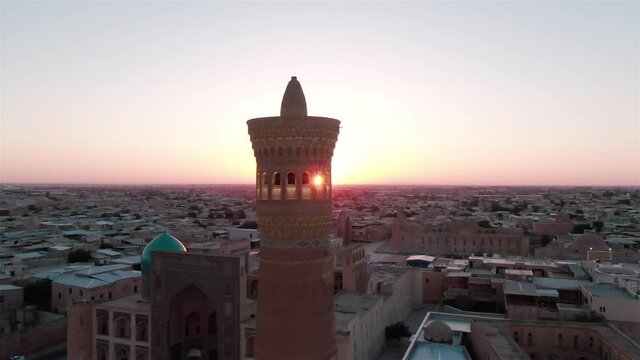 Po-i-Kalyan mosque complex in Bukhara and Kalyan Minaret at sunset, shot by a drone