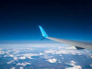 Obraz premium Travel by air. View from the wing of the aircraft at sunsets, sunrises, clouds.