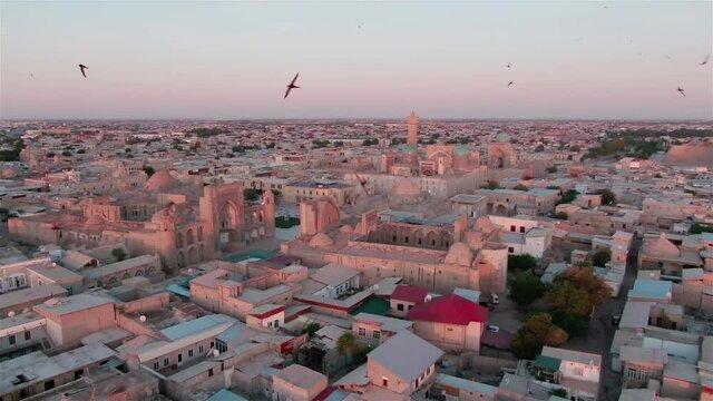 Old Bukhara city (Uzbekistan) panorama in the rays of the setting sun, shot by a drone